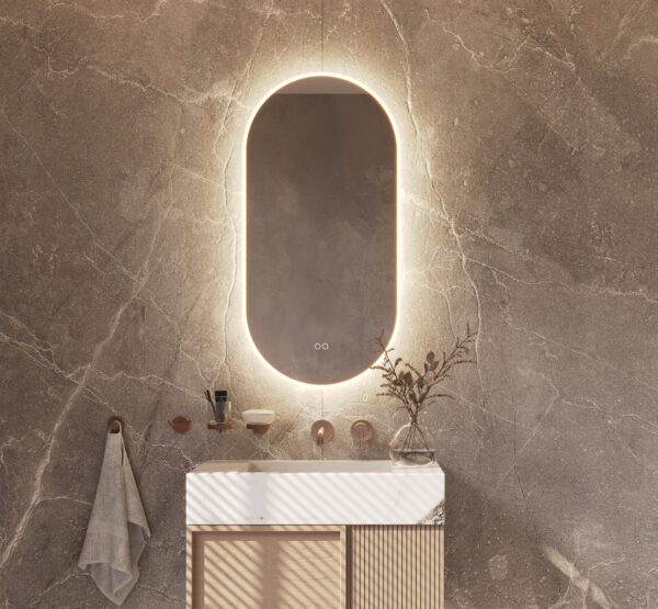 Deze ovale design spiegel van 45 cm breed en 90 cm hoog is van alle gemakken voorzien, zoals: geïntegreerde directe + indirecte verlichting, spiegelverwarming, instelbare lichtkleur en een dimfunctie